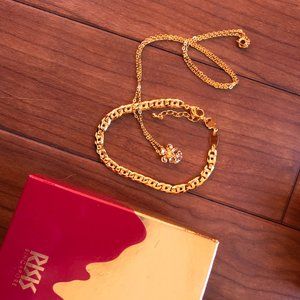 Orchid pendant and gold tone link bracelet